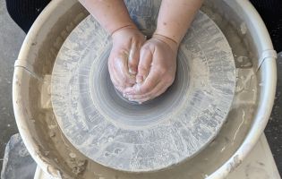 Hands Molding Clay on a Pottery Wheel 