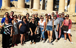 Group of People In Front of Greek Ruins