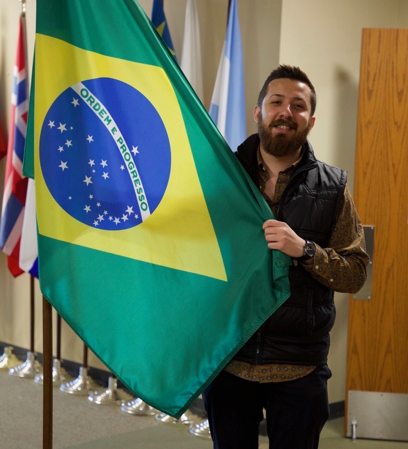 NWACC Student Holding a Brazilian Flag 