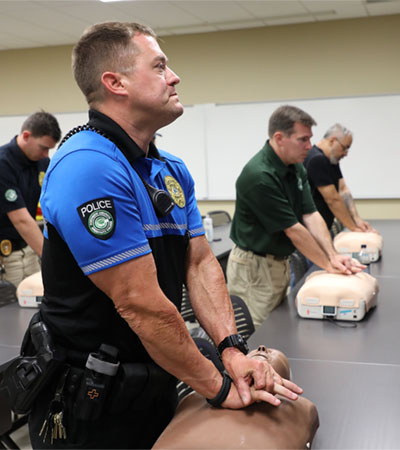 Police Officer Performing CPR