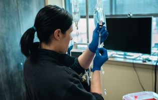 Woman Filling a Needle Syringe