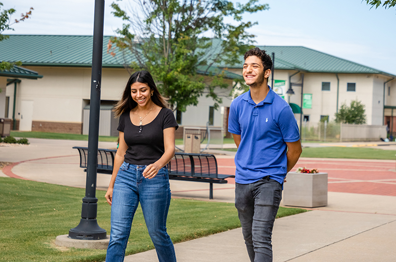 Two Students Walking Outside