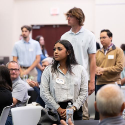 Scholarship breakfast student standing